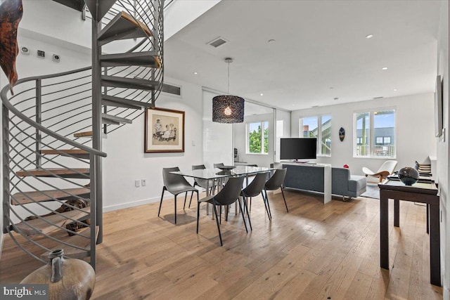 1932 9th St NW Unit R402, Washington, DC 20001 - dining space with hardwood / wood-style floors, stairway, recessed lighting, and baseboards