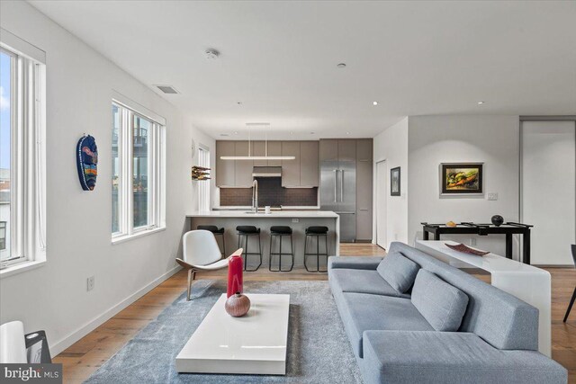 1932 9th St NW Unit R402, Washington, DC 20001 - living room with light wood-style floors, recessed lighting, and baseboards