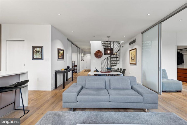 1932 9th St NW Unit R402, Washington, DC 20001 - living room with light wood finished floors, recessed lighting, and baseboards