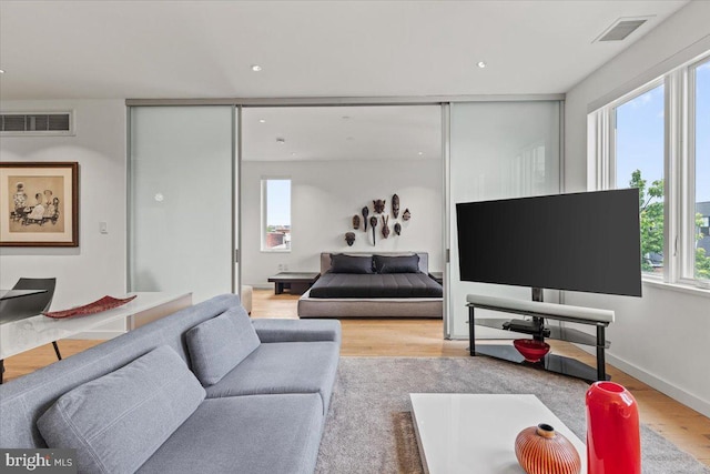 1932 9th St NW Unit R402, Washington, DC 20001 - living room featuring plenty of natural light, wood finished floors, and recessed lighting