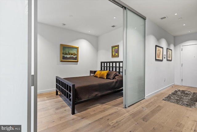 1932 9th St NW Unit R402, Washington, DC 20001 - bedroom with hardwood / wood-style floors, recessed lighting, and baseboards