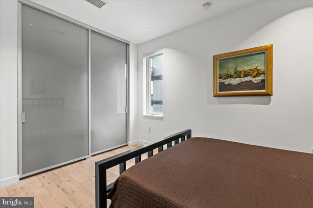 1932 9th St NW Unit R402, Washington, DC 20001 - bedroom featuring light wood finished floors and a closet