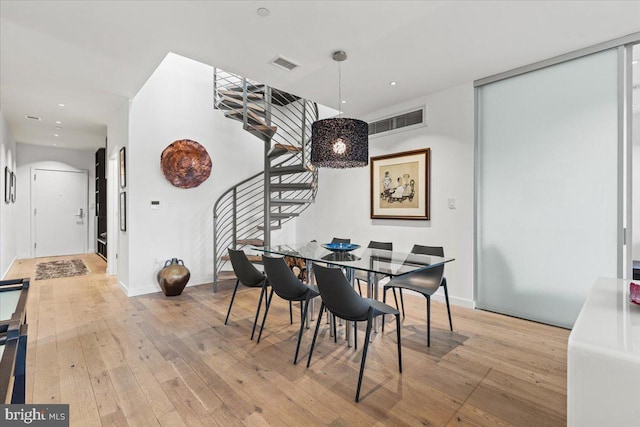 1932 9th St NW Unit R402, Washington, DC 20001 - dining area featuring stairway, hardwood / wood-style flooring, recessed lighting, and baseboards