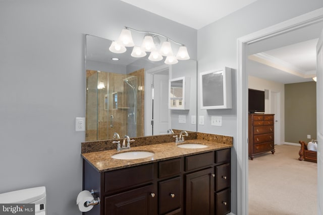 full bathroom featuring a shower stall, double vanity, toilet, and ornamental molding