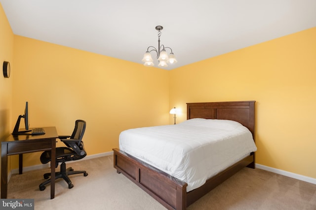 bedroom with light carpet, baseboards, and a chandelier