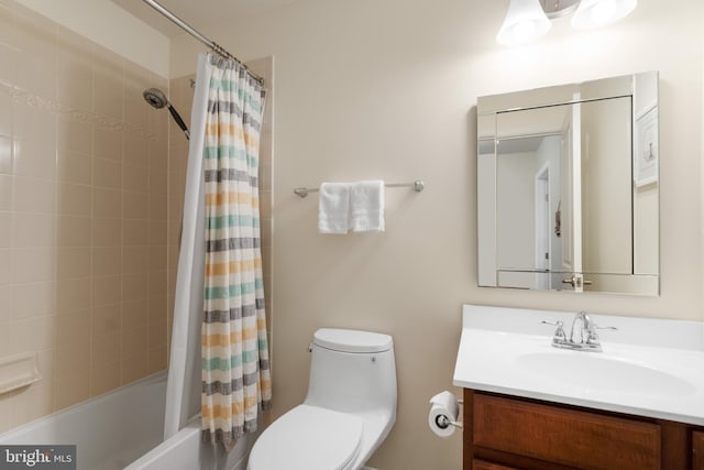 full bath with vanity, shower / tub combo with curtain, and toilet