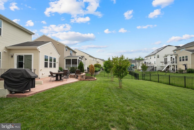 view of yard with a residential view and a patio area