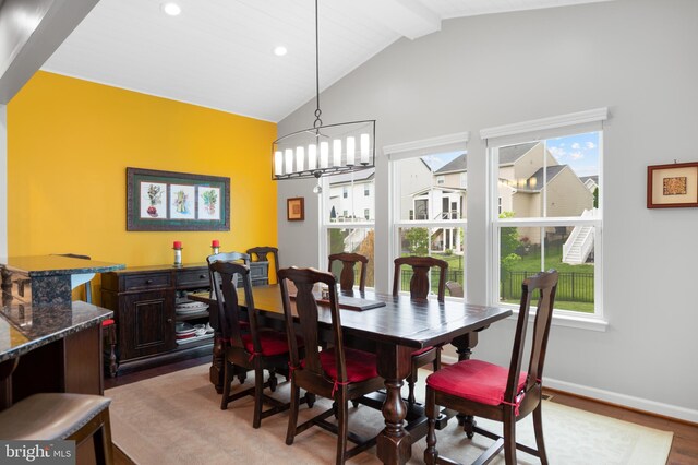 dining space with wood finished floors, baseboards, recessed lighting, beam ceiling, and high vaulted ceiling