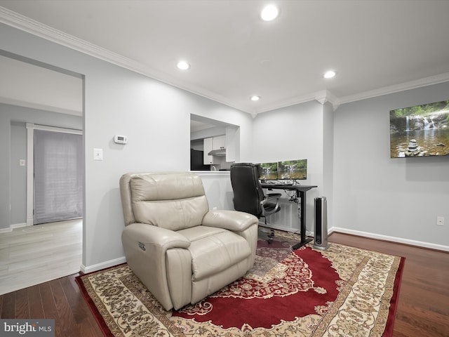 living area featuring ornamental molding, recessed lighting, baseboards, wood finished floors, and a desk