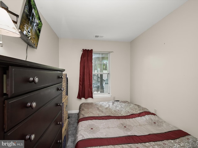 bedroom with carpet floors and baseboards