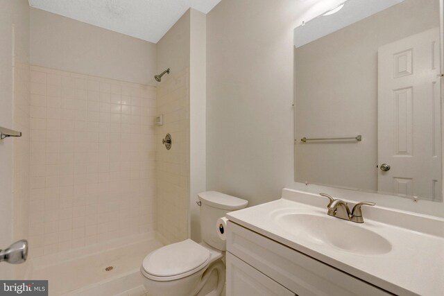 12106 Green Leaf Ct Unit 102, Fairfax, VA 22033 - full bath featuring toilet, a tile shower, and vanity
