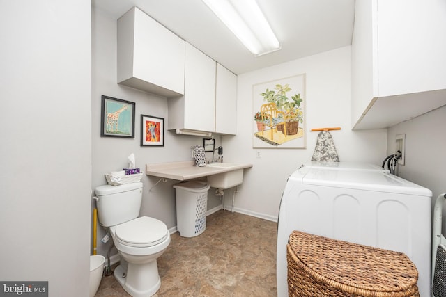 26882 Pratt Rd, Salisbury, MD 21801 - bathroom with washer and dryer, toilet, baseboards, and a bath