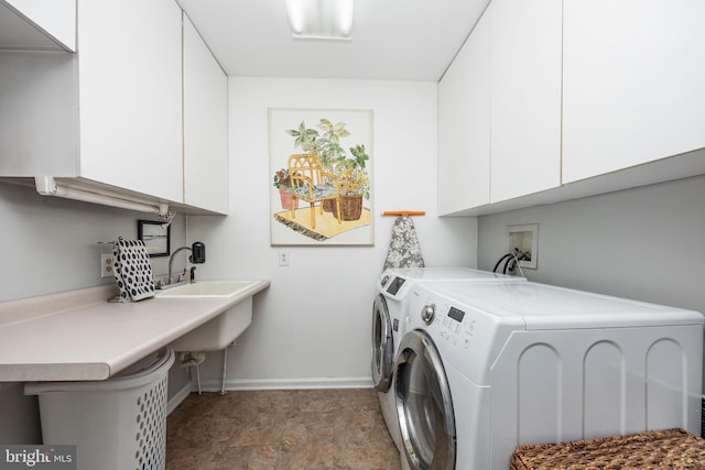 26882 Pratt Rd, Salisbury, MD 21801 - clothes washing area with cabinet space, washer and dryer, and baseboards
