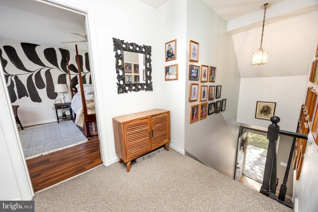 26882 Pratt Rd, Salisbury, MD 21801 - hall featuring an upstairs landing, carpet, lofted ceiling, and baseboards
