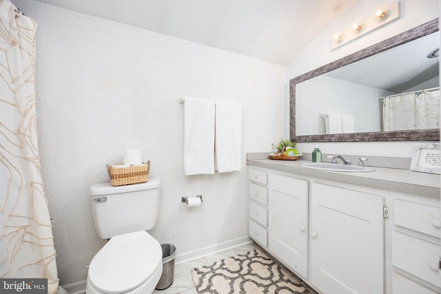 26882 Pratt Rd, Salisbury, MD 21801 - bathroom featuring vaulted ceiling, toilet, vanity, and baseboards