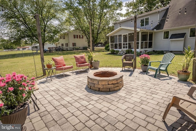 26882 Pratt Rd, Salisbury, MD 21801 - view of patio / terrace featuring an outdoor fire pit and a sunroom