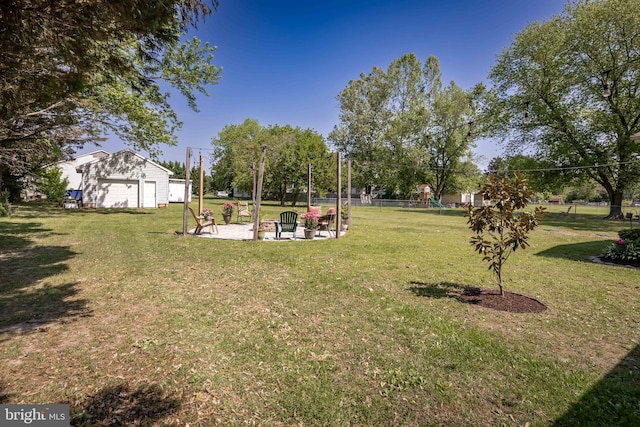 26882 Pratt Rd, Salisbury, MD 21801 - view of grassy yard with an outbuilding and a playground