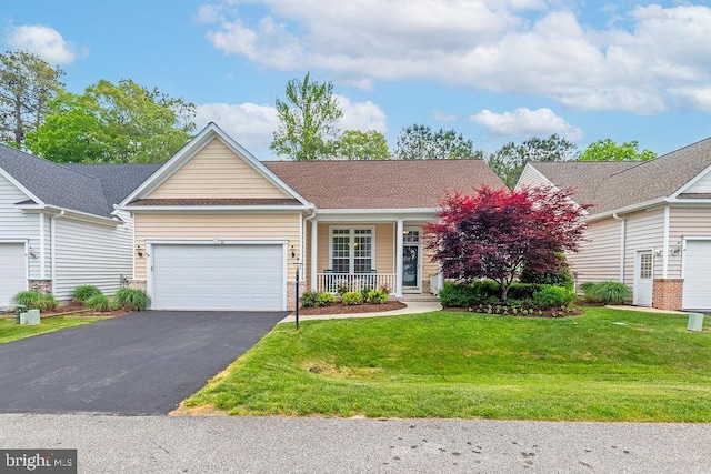111 Central Parke E, Ocean Pines, MD 21811 - view of front facade with a garage, a porch, asphalt driveway, and a front lawn