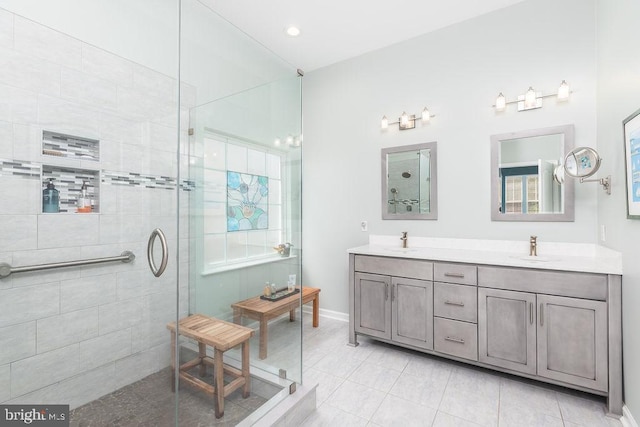 111 Central Parke E, Ocean Pines, MD 21811 - full bathroom with a tile shower, double vanity, and baseboards