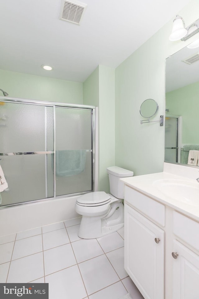 111 Central Parke E, Ocean Pines, MD 21811 - bathroom with toilet, tile patterned flooring, vanity, enclosed tub / shower combo, and recessed lighting