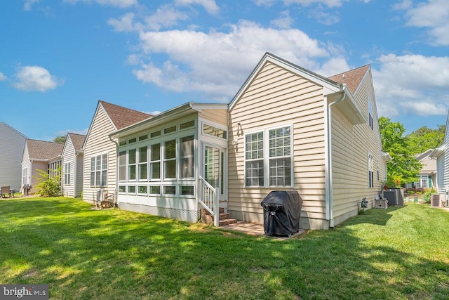 111 Central Parke E, Ocean Pines, MD 21811 - rear view of house featuring a lawn, entry steps, and cooling unit