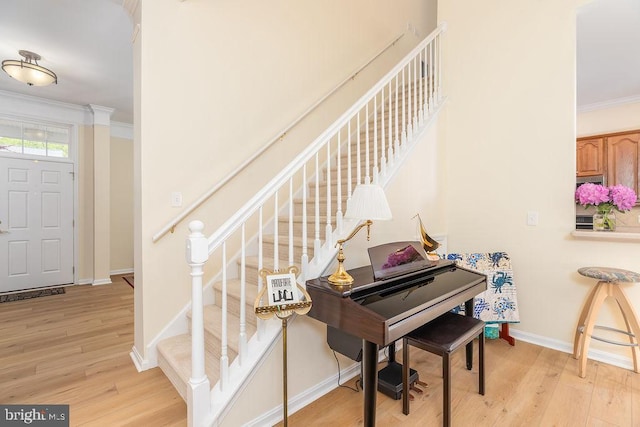 111 Central Parke E, Ocean Pines, MD 21811 - stairs featuring wood finished floors, ornamental molding, and baseboards