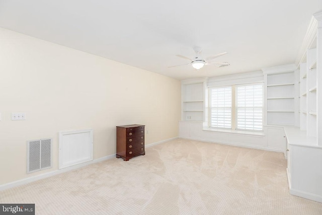 111 Central Parke E, Ocean Pines, MD 21811 - spare room featuring ceiling fan, light colored carpet, baseboards, and built in shelves