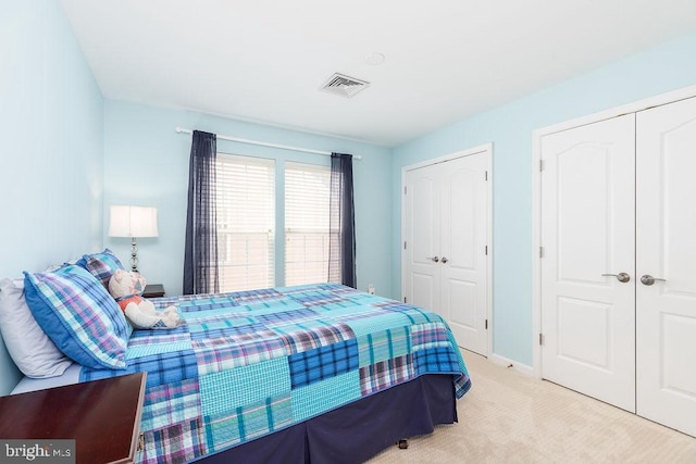 111 Central Parke E, Ocean Pines, MD 21811 - bedroom with carpet, two closets, and baseboards