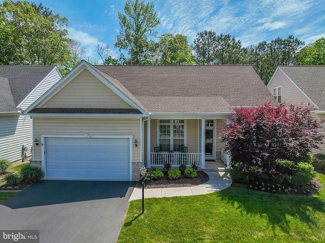 111 Central Parke E, Ocean Pines, MD 21811 - view of front facade featuring a porch, asphalt driveway, a garage, a front yard, and roof with shingles