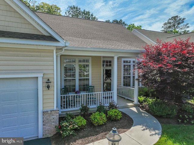 111 Central Parke E, Ocean Pines, MD 21811 - doorway to property featuring covered porch, roof with shingles, and an attached garage