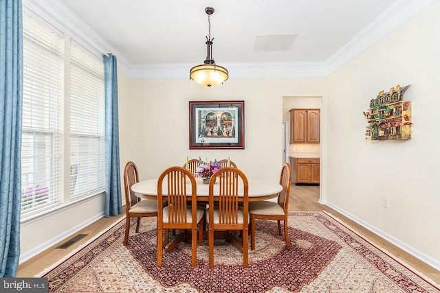 111 Central Parke E, Ocean Pines, MD 21811 - dining room with light wood-style flooring, ornamental molding, and baseboards