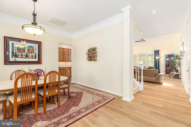 111 Central Parke E, Ocean Pines, MD 21811 - dining space featuring light wood finished floors, ornamental molding, stairway, baseboards, and ceiling fan