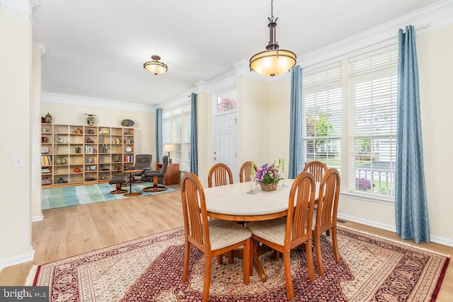 111 Central Parke E, Ocean Pines, MD 21811 - dining room with healthy amount of natural light, ornamental molding, wood finished floors, and baseboards