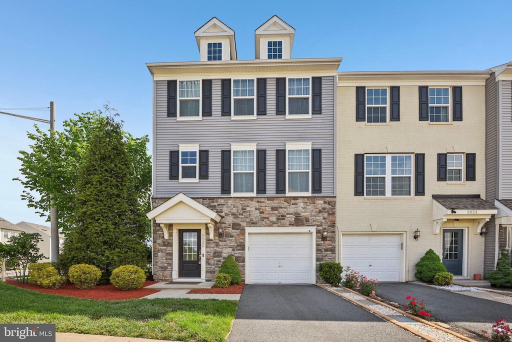 9926 Whitemoss Dr, Manassas, VA 20109 - multi unit property with driveway, stone siding, and a garage
