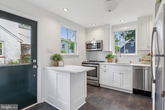 129 Kreutz Ave, Doylestown, PA 18901 - kitchen featuring stainless steel appliances, white cabinets, backsplash, and recessed lighting