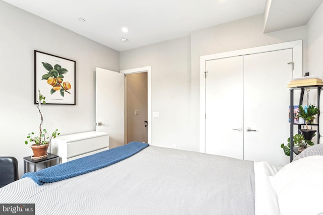 bedroom with a closet and recessed lighting