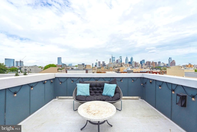 view of patio / terrace with a skyline view and a balcony