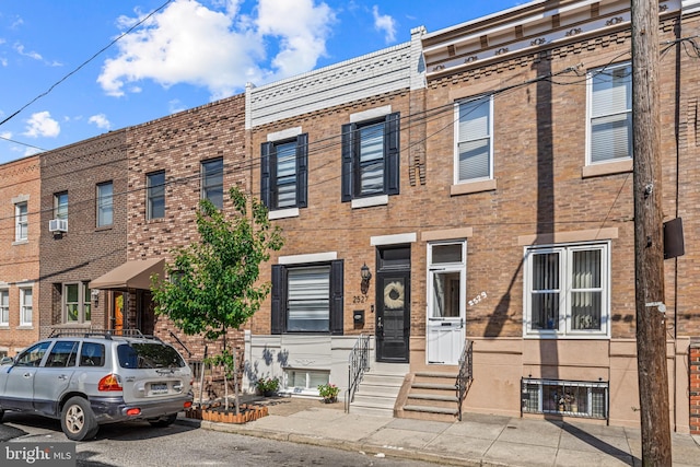 multi unit property with entry steps and brick siding