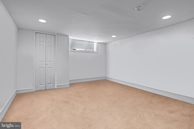 below grade area featuring carpet, baseboards, and recessed lighting