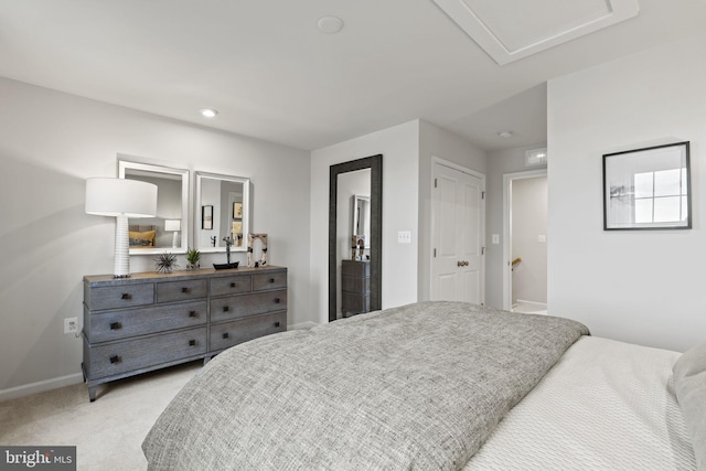 bedroom featuring light colored carpet, baseboards, recessed lighting, and attic access