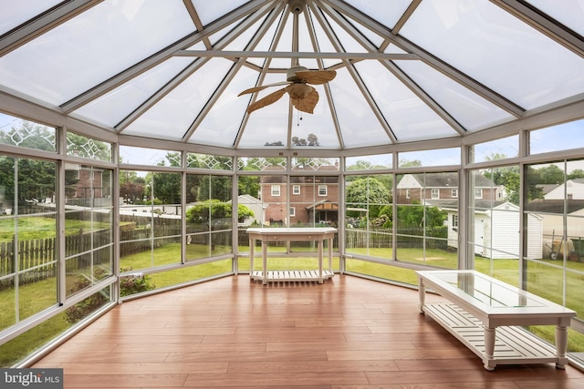 sunroom / solarium featuring a ceiling fan and vaulted ceiling