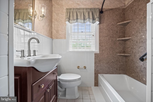 full bathroom with tile patterned floors, toilet, vanity, bathtub / shower combination, and tile walls