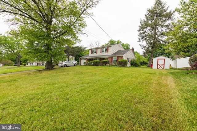 view of front of property with a storage shed, brick siding, and an outdoor structure