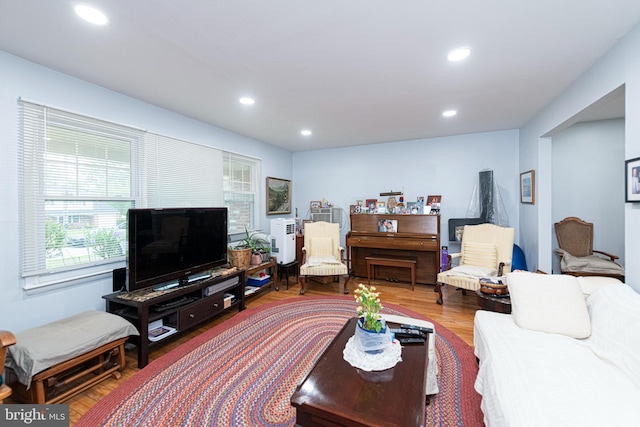 living area featuring plenty of natural light, recessed lighting, and wood finished floors