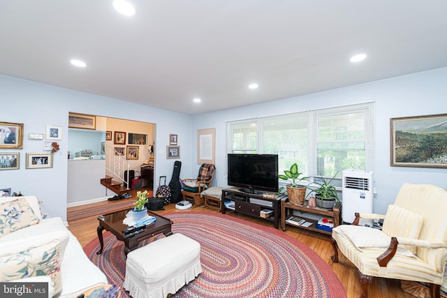 living room featuring wood finished floors and recessed lighting