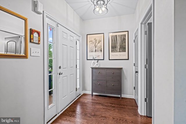 entrance foyer featuring dark wood-style floors and baseboards