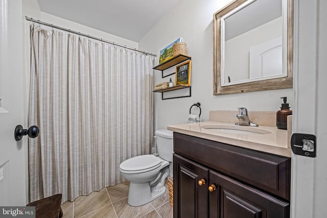 full bathroom with toilet and vanity