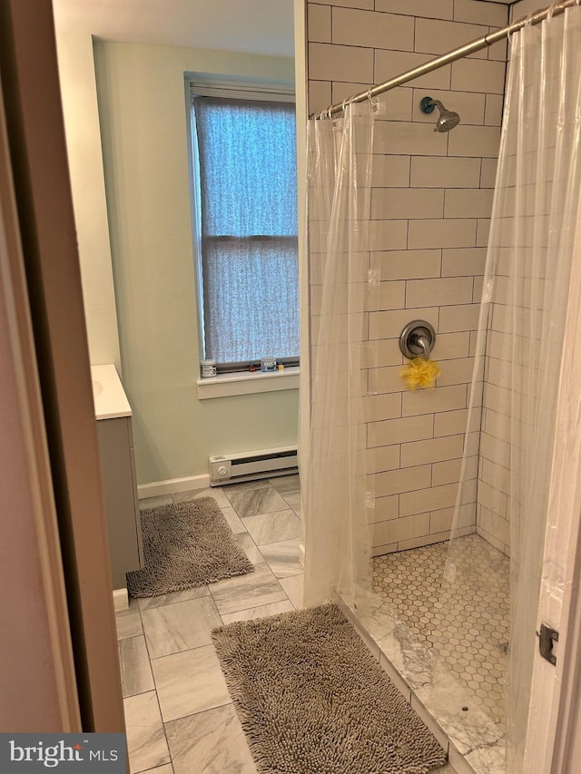 402 Market St, Marcus Hook, PA 19061 - full bath featuring a baseboard radiator, tiled shower, baseboards, and vanity