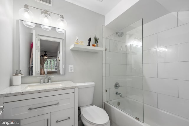 full bathroom with vanity, toilet, a ceiling fan, and tub / shower combination
