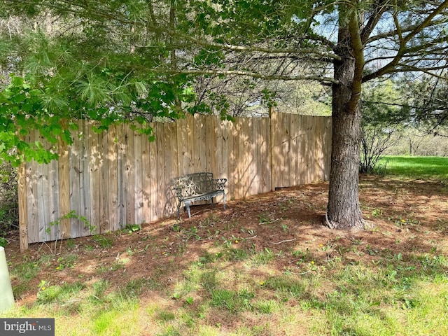 view of yard featuring fence